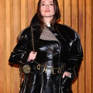 Aimee Lou Wood wearing a leather jacket at Paris Fashion Week with sleek tailored fit and modern design.