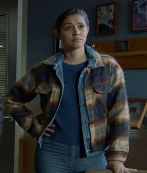 Miranda Rae Mayo as Stella Kidd in Chicago Fire Season 13 wearing a hybrid denim and plaid jacket with casual fit and mixed fabric design.