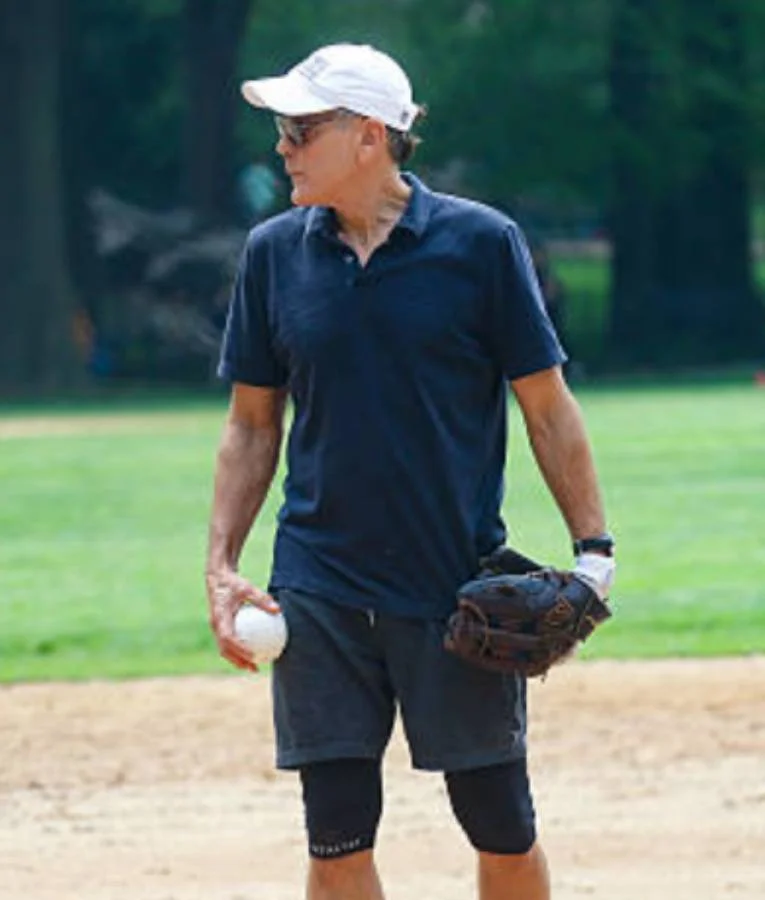 George Clooney wearing a polo shirt in NYC 2025, featuring a classic collar, short sleeves, and a tailored casual fit.”