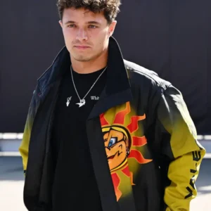 Lando Norris at the F1 Grand Prix of Italy wearing a stylish racing jacket featuring McLaren team logos and sporty detailing.