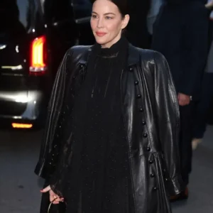 Liv Tyler wearing a black leather long coat at Paris Fashion Week 2025 with elegant tailored fit and sleek design.”