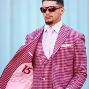 Patrick Mahomes arriving in Jacksonville wearing a tailored suit with classic fit and formal style.