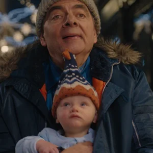 “Rowan Atkinson Man VS Baby 2025 hooded jacket displayed on a hanger.”