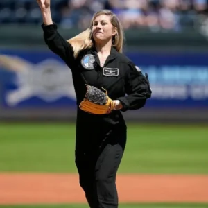 “Anna Menon wearing a SpaceX jumpsuit featuring a fitted astronaut-style design, zip front, and mission-style detailing.”