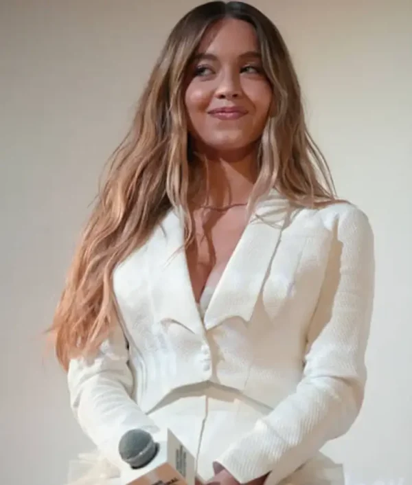Sydney Sweeney wearing a white cropped blazer at the Christy US Premiere with tailored fit and modern chic design