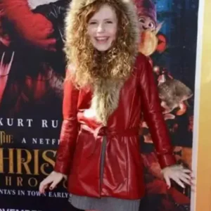 Darby Camp wearing a long premiere coat in The Christmas Chronicles 2, featuring a warm wool-like fabric, button closure, and elegant winter design.