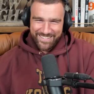 Travis Kelce New Heights maroon graphic hoodie with bold front print and casual relaxed fit.