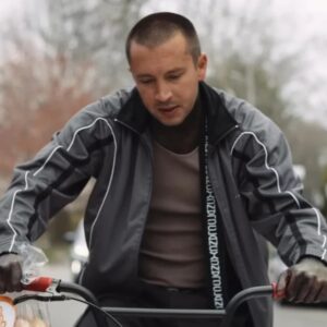 Twenty One Pilots Backslide Jacket in black and gray, featuring color-blocked panels, zip-up front, and band-inspired streetwear design